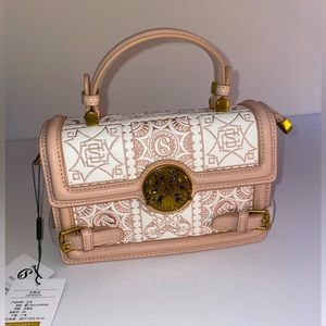 Pink and white accordion purse